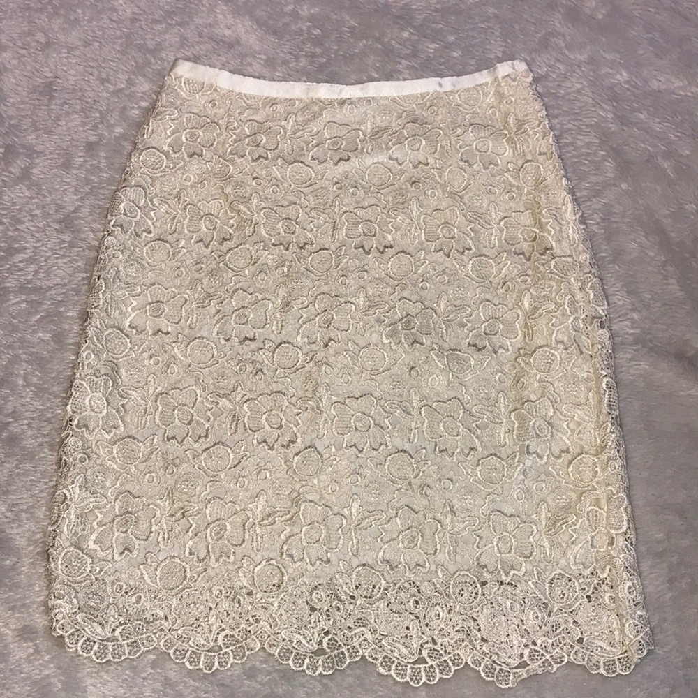 H&M Beautiful cream skirt with lace overlay.